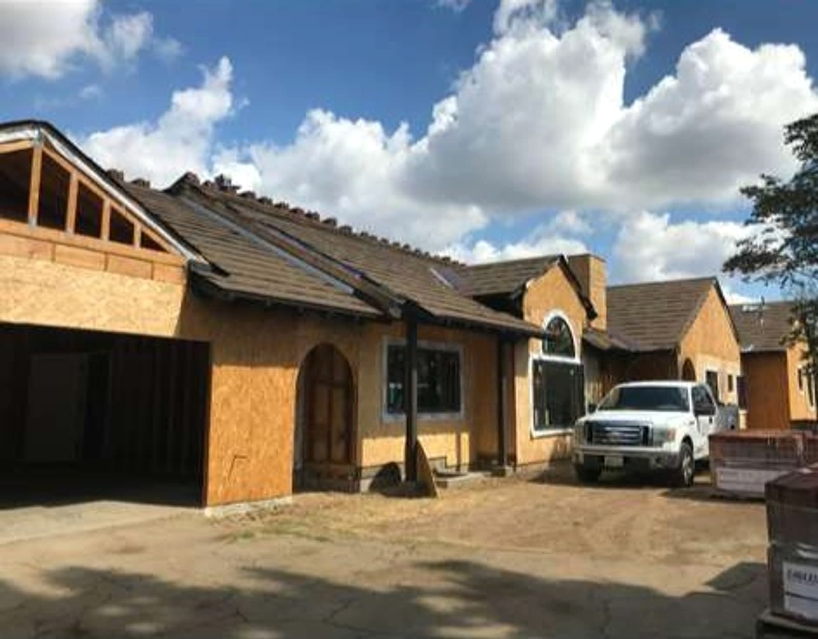 Completed roofing project with fresh roof materials