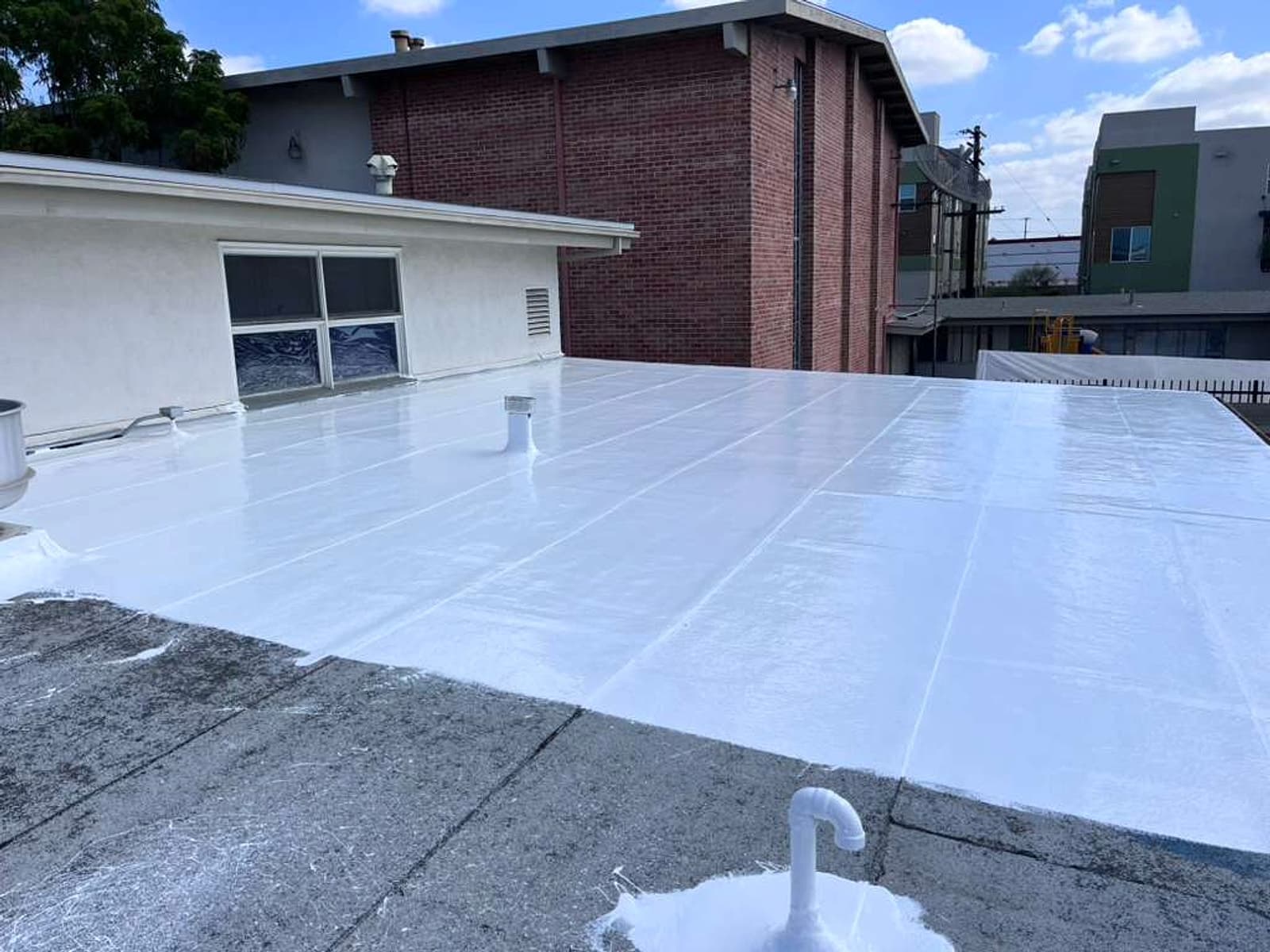 Roofing project with finished roof sections